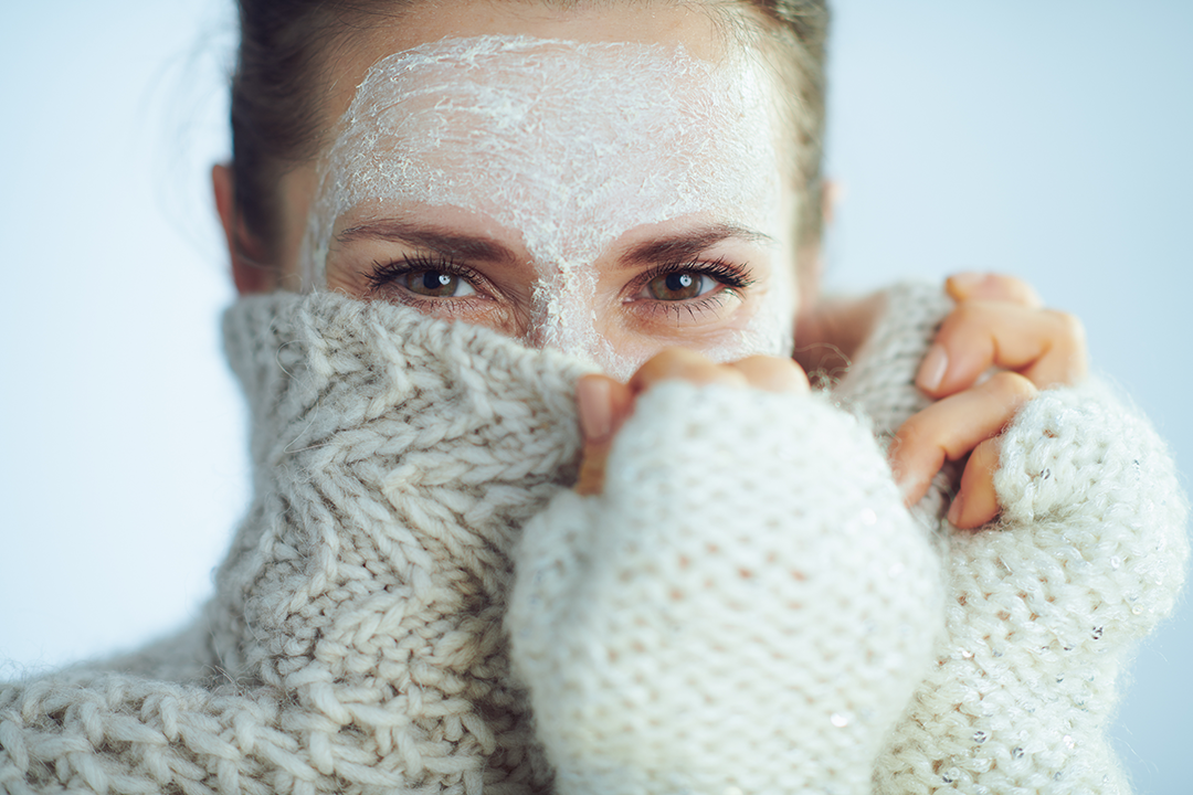 Winter skin care woman with sweater